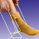 Illustration for article titled A Tool to Help Pull Socks Up